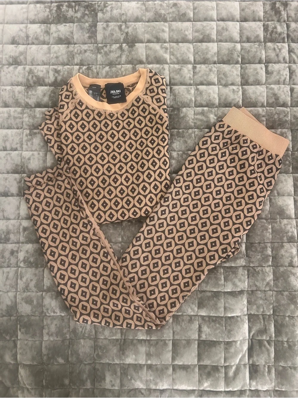 Zara Tan and Black Geometric Ski under layer